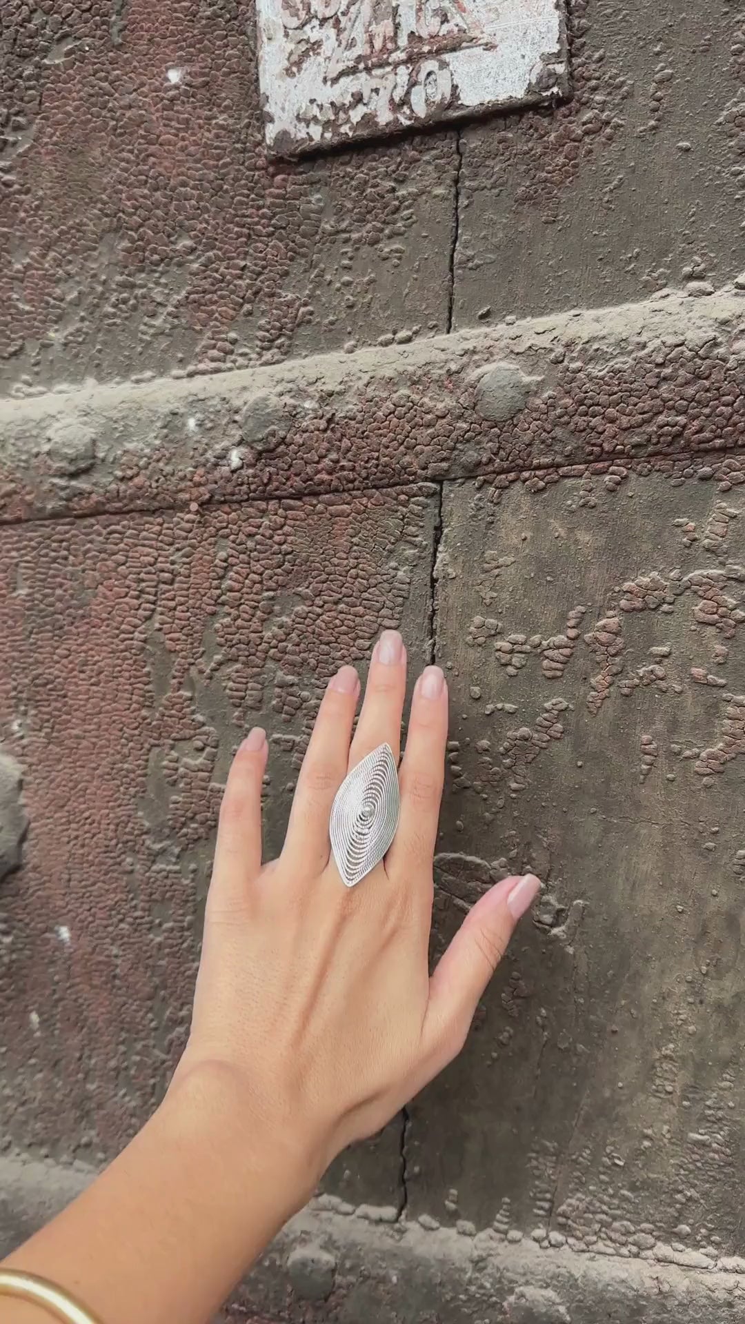 silver enlongated ring